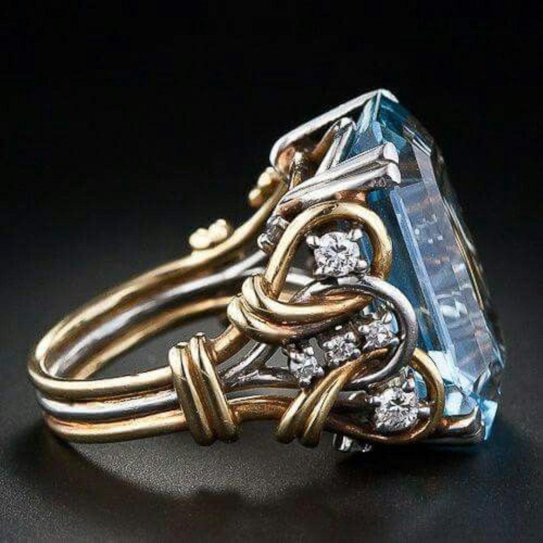 Guldring med blå zirkon i vintage stil