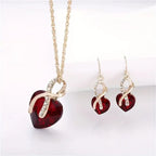 Guld Rubin Twisted Heart Smykkesæt