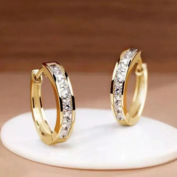 1+1 Tilbud: Elegant Guld og Krystal Øreringe + Elegant armbånd med zirkonia i guld